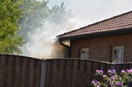 Houtstapel brandt in Onze-Lieve-Vrouwstraat