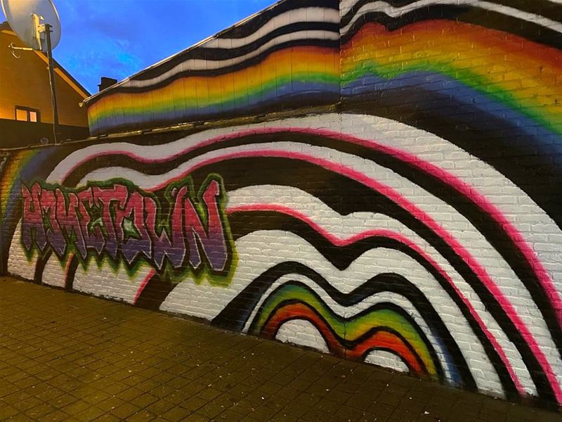 Graffiti maken Onder de Poort tot kleurrijke buurt