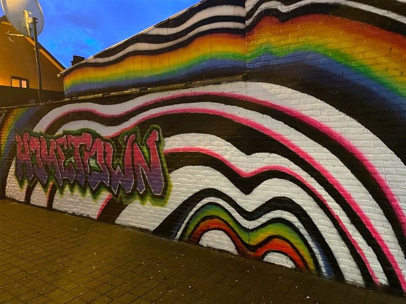 Graffiti maken Onder de Poort tot kleurrijke buurt