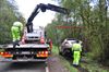 Wagens in gracht na inhaalmanoeuvre