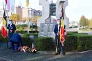 Bloemenhulde aan monument in Zolder