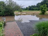 Opvangbekken in Beemdenstraat loopt over