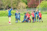 Jonge rugbyspelers leveren vinnige strijd